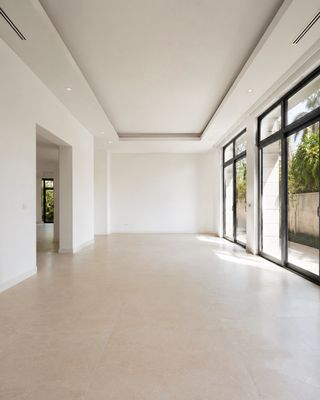 Vacant villa living room repainted to a neutral landlord-standard finish, ready for tenancy handover in Dubai