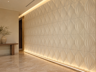 Decorative 3D gypsum feature wall with geometric relief and warm uplighting