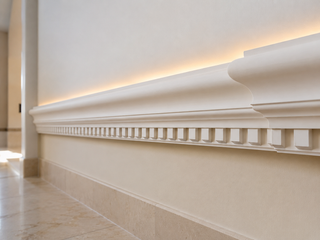 Classical ogee plaster cornice with dentil band running along a villa interior ceiling junction