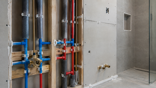Concealed insulated pipework in wet room