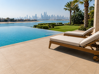 Pool surround in anti-slip R11 porcelain around an infinity pool
