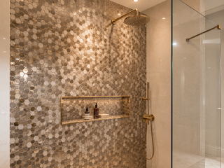 Mosaic shower feature wall with niche detail in bronze, smoke and pearl glass mosaic