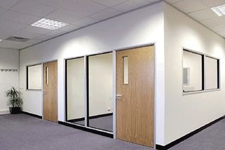 Finished office fit-out with gypsum partitions, glazed panels and timber doors